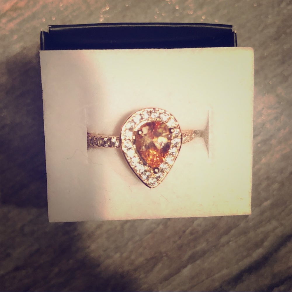 Size 7 yellow ring. Never worn. New with box.